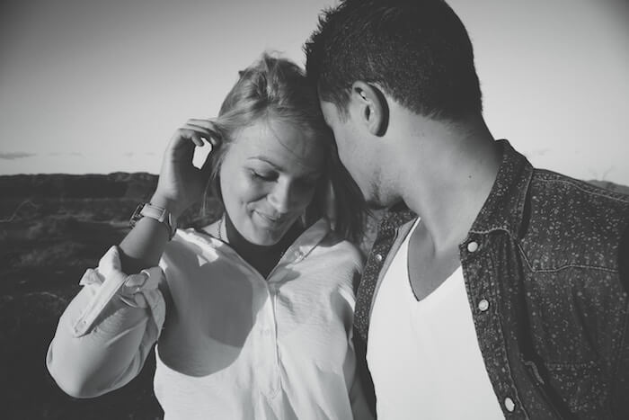 man and woman outside talking Personal Questions To Ask A Girl