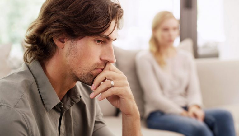 unhappy man and woman, how to fix trust issues in your relationship