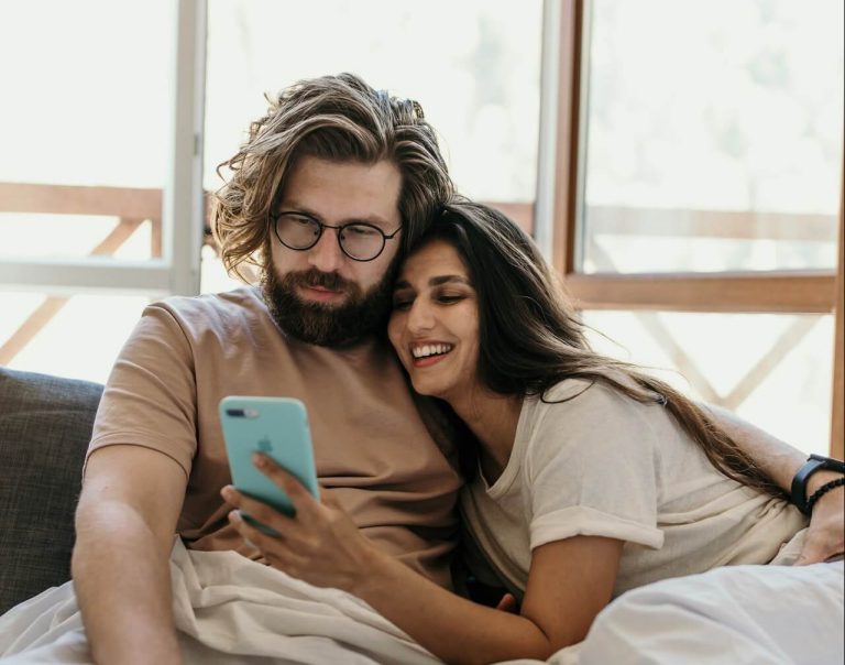 couple looking at phone, apps for couples