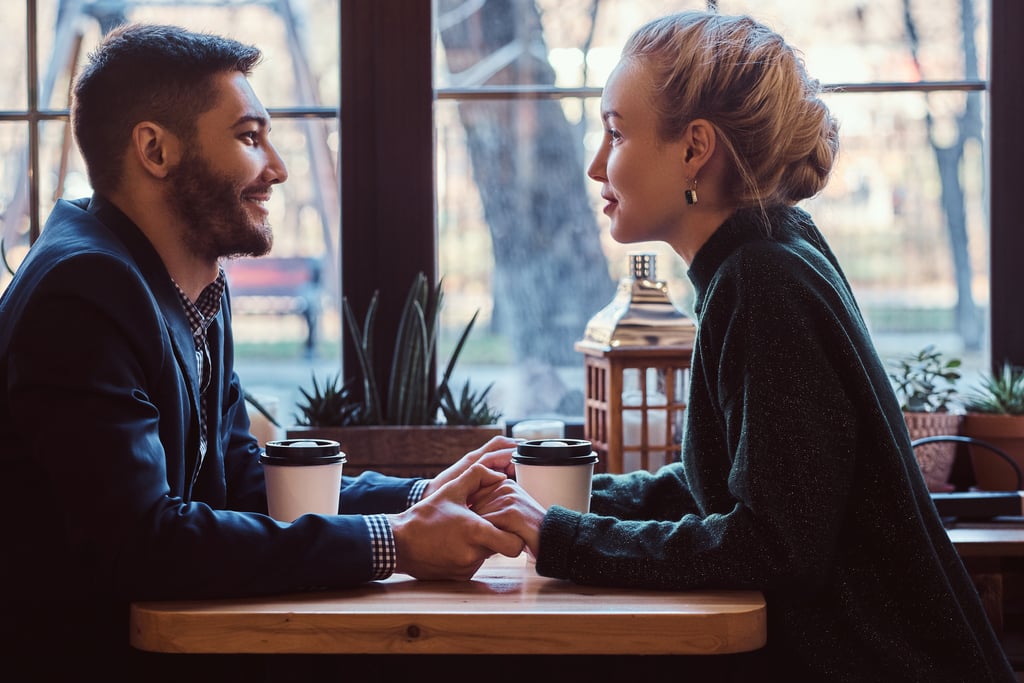 couple holding hands while having coffee compliments for women