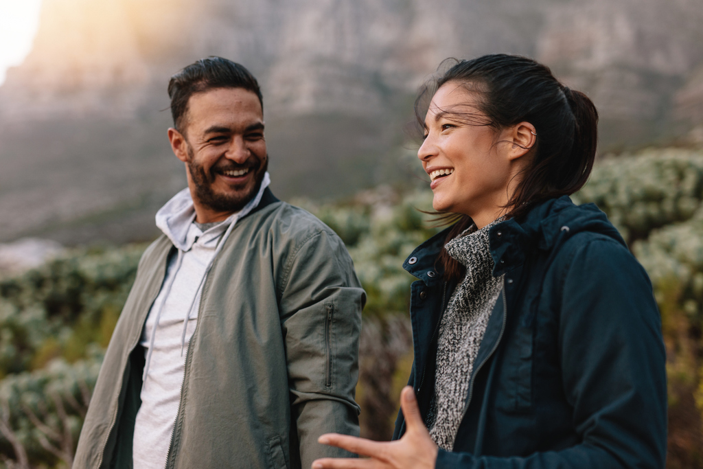 couple outdoors smiling signs she wants a serious relationship with you