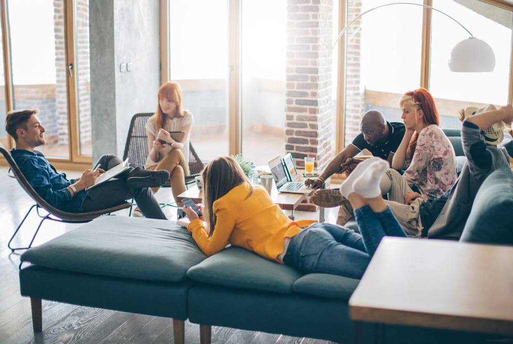 group of young adults sitting trying to please everyone