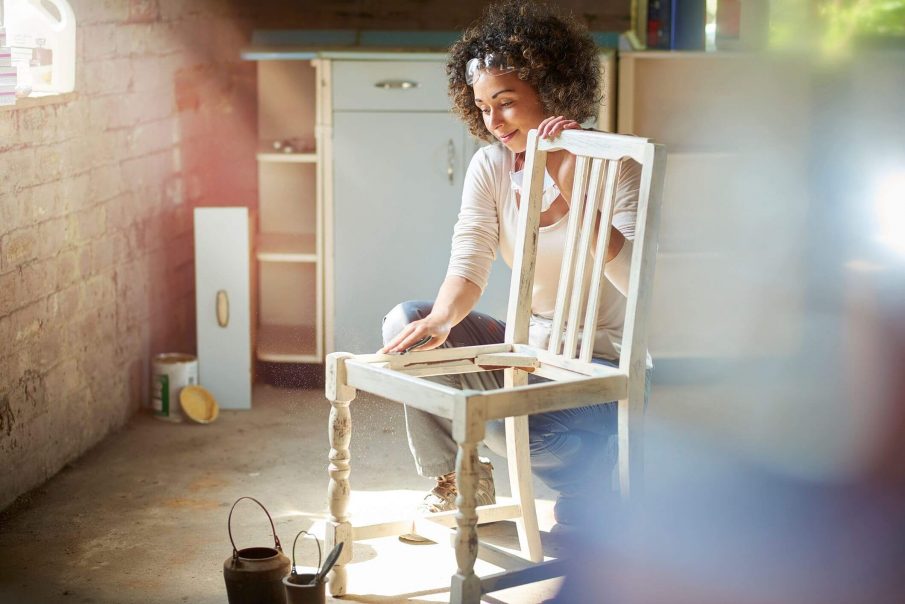 woman refinishing chair, are interests and hobbies the same thing