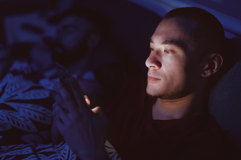 man using phone in bed Thoughtful And Sweet Long Messages For Her