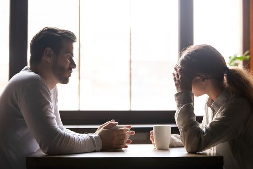 couple talking in a coffee shop how to end an emotional affair