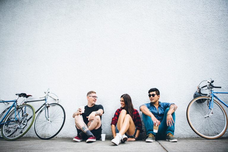 cyclists sitting by wall how to choose between two men