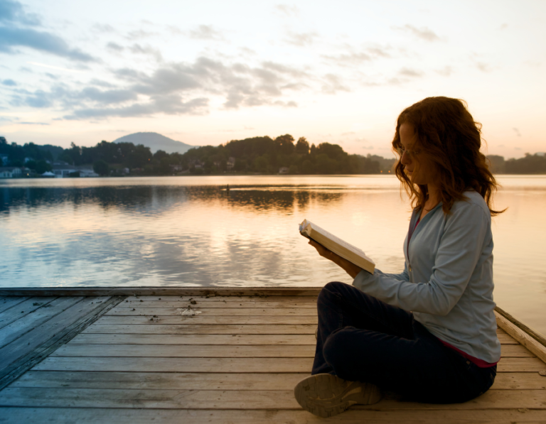 young woman reading by the beach soul quotes