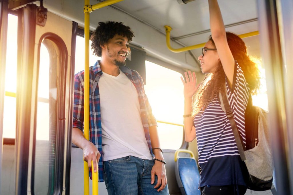 girl and boy looking sweet in the bus Signs of Unspoken Mutual Attraction