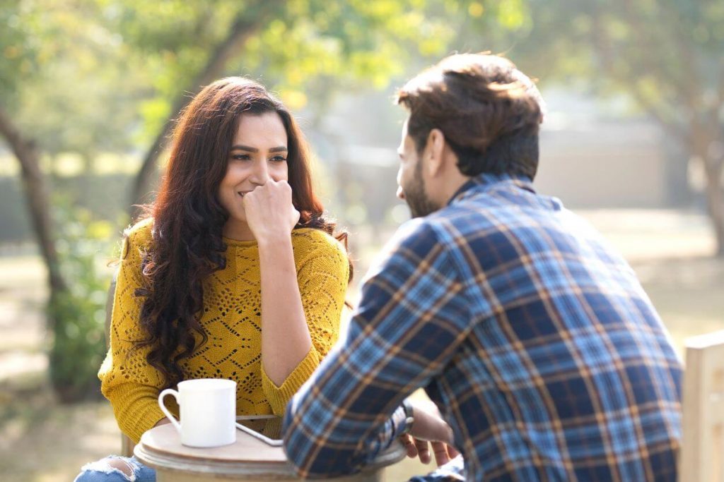 man and woman in a coffee date Signs of Unspoken Mutual Attraction