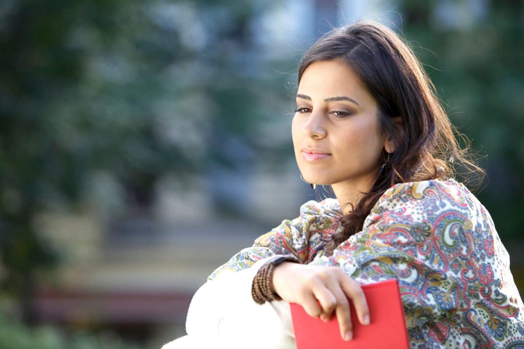 woman sitting alone outside Ways to Gain Self Respect