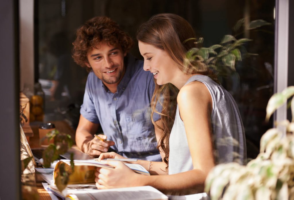 couple talking at table icebreaker questions for dating