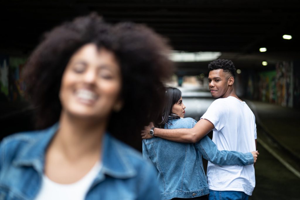 woman smiling as man turns to look at her turn-offs for women