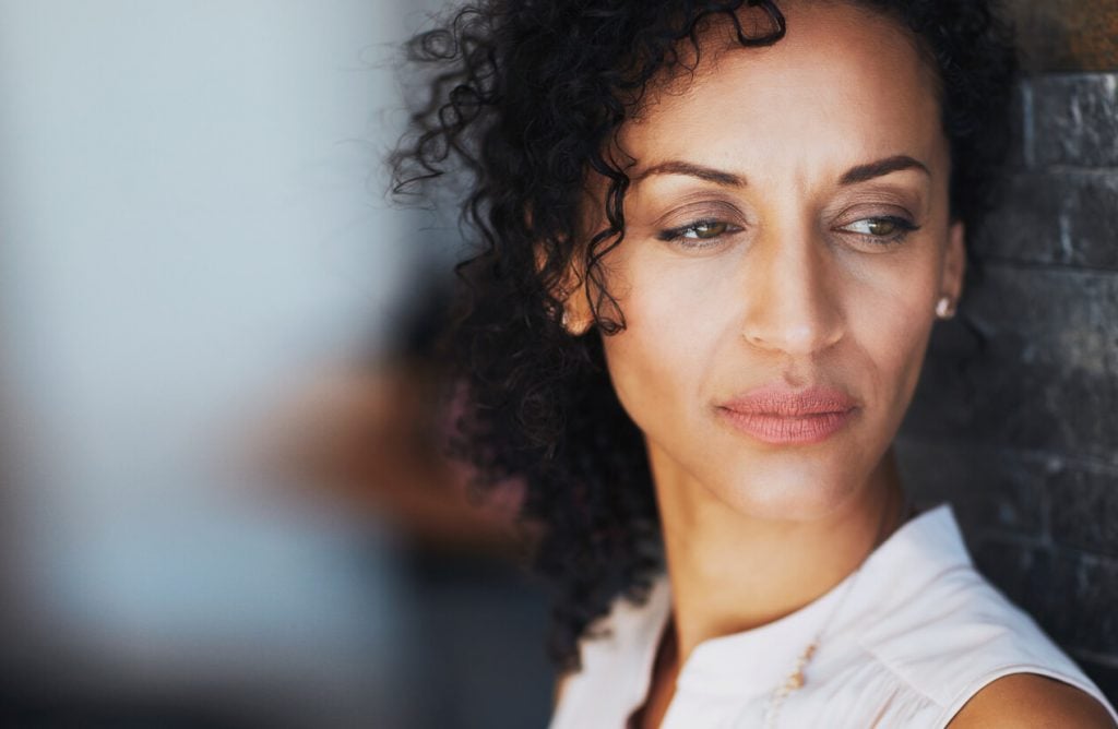 close up of woman in thought personality strengths and weaknesses list