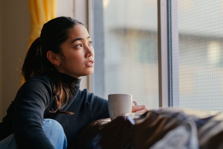 woman looking out window, I don't know what to do with my life