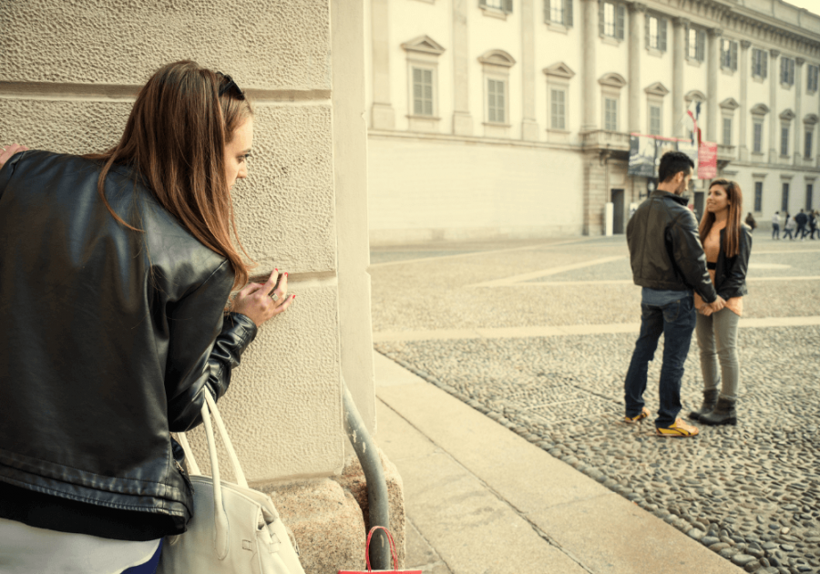 woman spying on couple signs your ex is trying to get your attention on social media