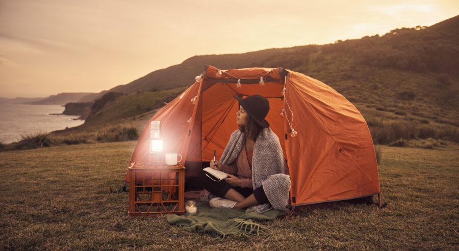 woman journaling in tent, types of empaths