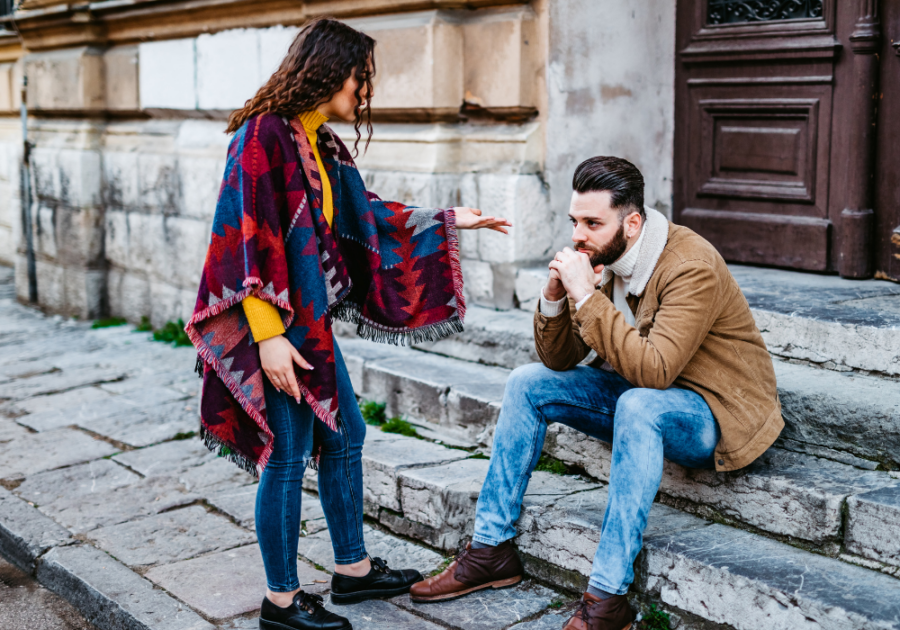 couple fighting in the sidewalk signs he will never come back