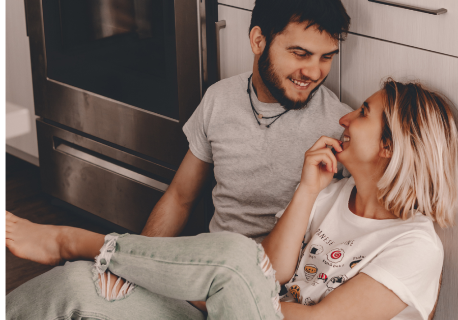 couple laughing in kitchen yes or no questions for couples