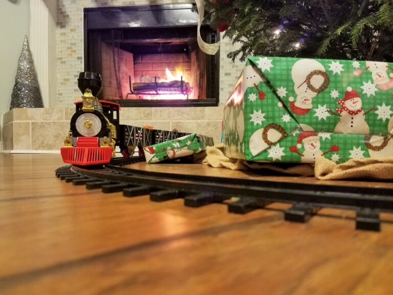 train set on floor of house Christmas Tree Train Sets