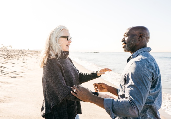 man and woman on beach smiling passion-purpose