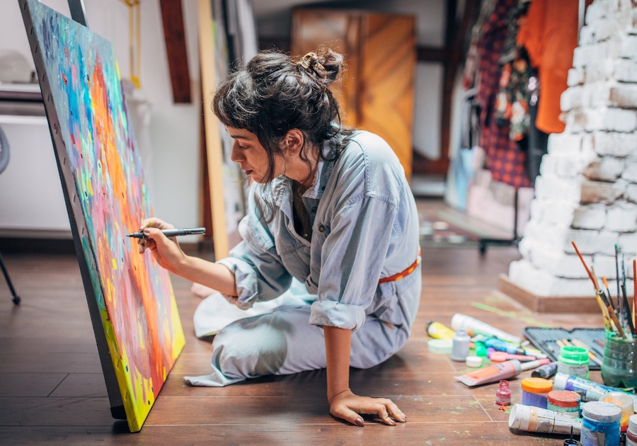 woman painting sitting of floor passion-purpose