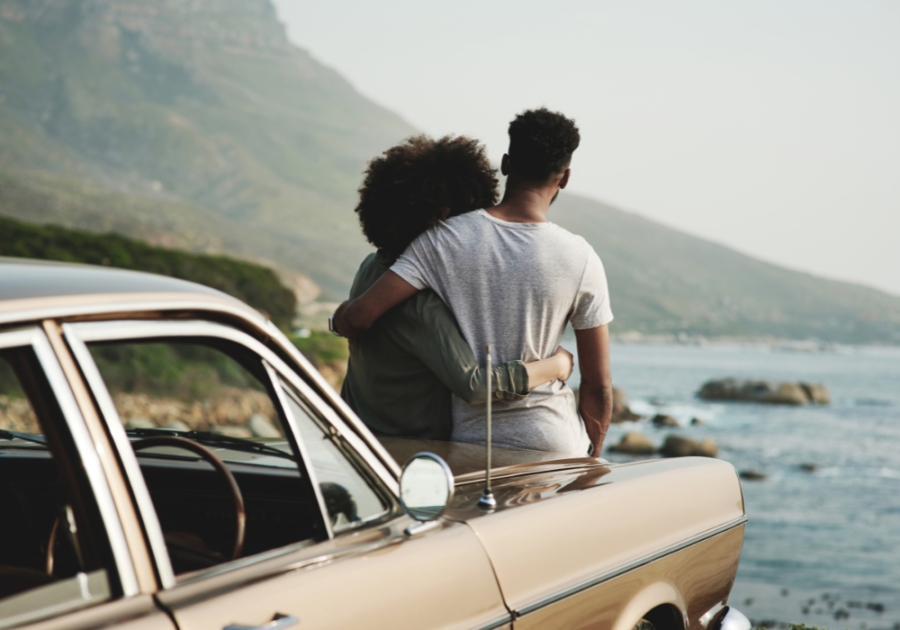 sweet couple watching the waves of the sea signs your soulmate is thinking about you