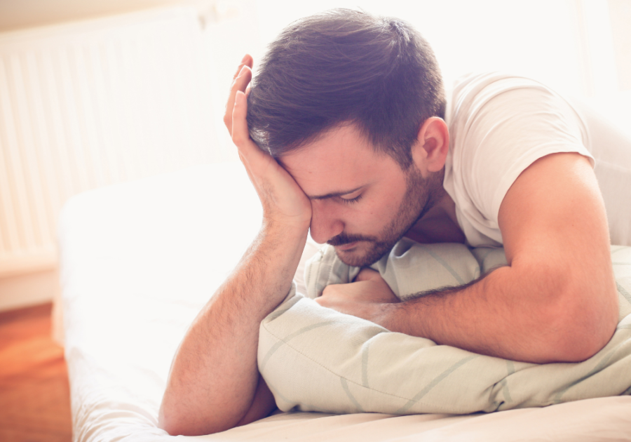 man with a headache lying in bed spiritual meaning of dreaming about the same person