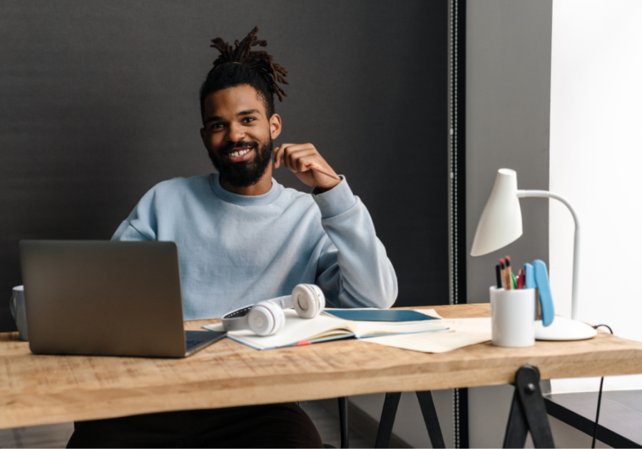 man in his desk smiling what is an omega male