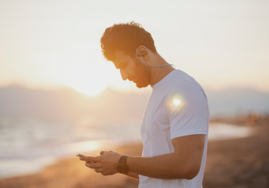 man scrolling his phone what is an omega male