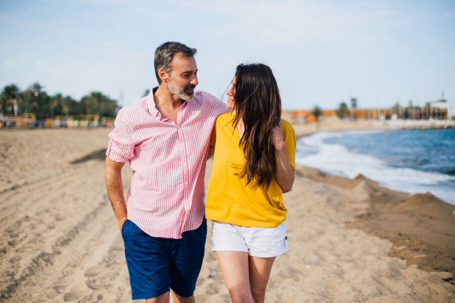 older man younger woman having a date on the beach signs an older man is falling in love with you