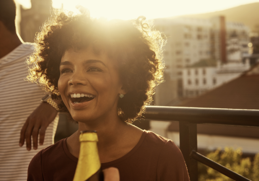 a smiling woman being overly happy dynamic personality