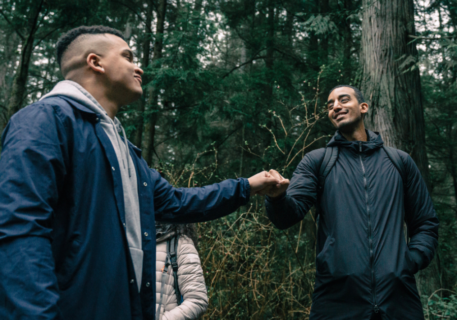 two men in the forest being friendly sigma male vs alpha male