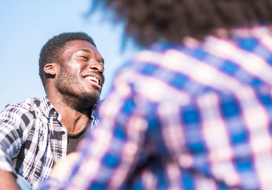 man laughing how to be more witty