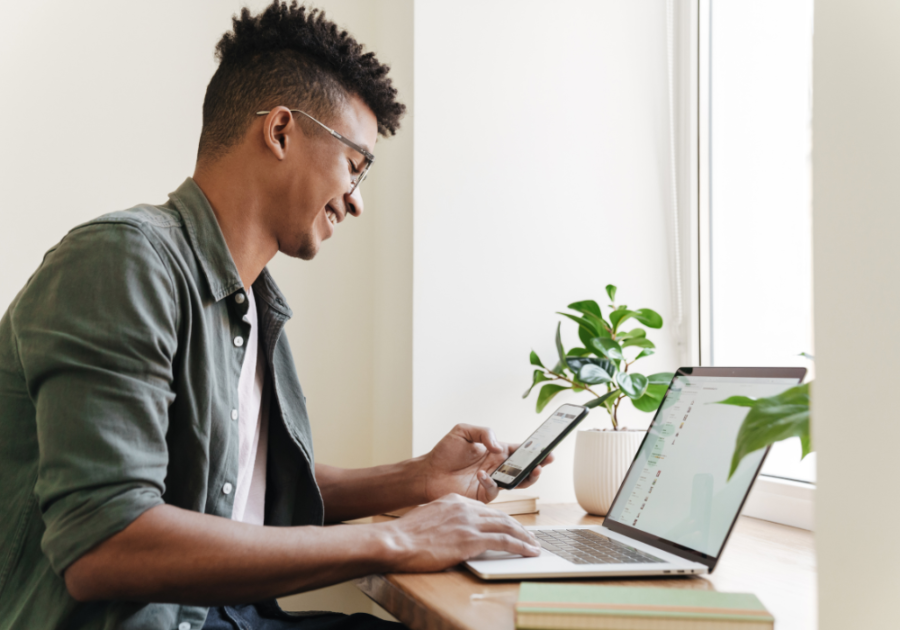 man happily working on his laptop emotional goals