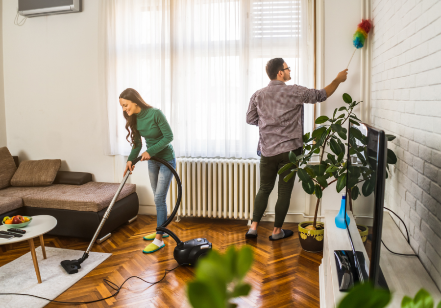 young couple cleaning their house together equality in relationships