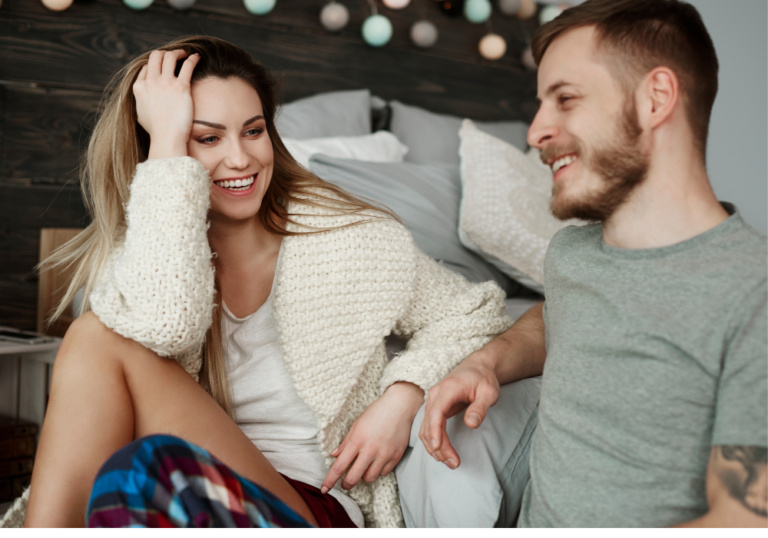 couple sitting on sofa talking questions to ask your boyfriend to test his love