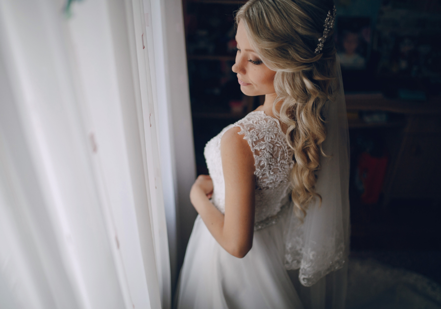 bride standing in wedding gown letter to wife on wedding day