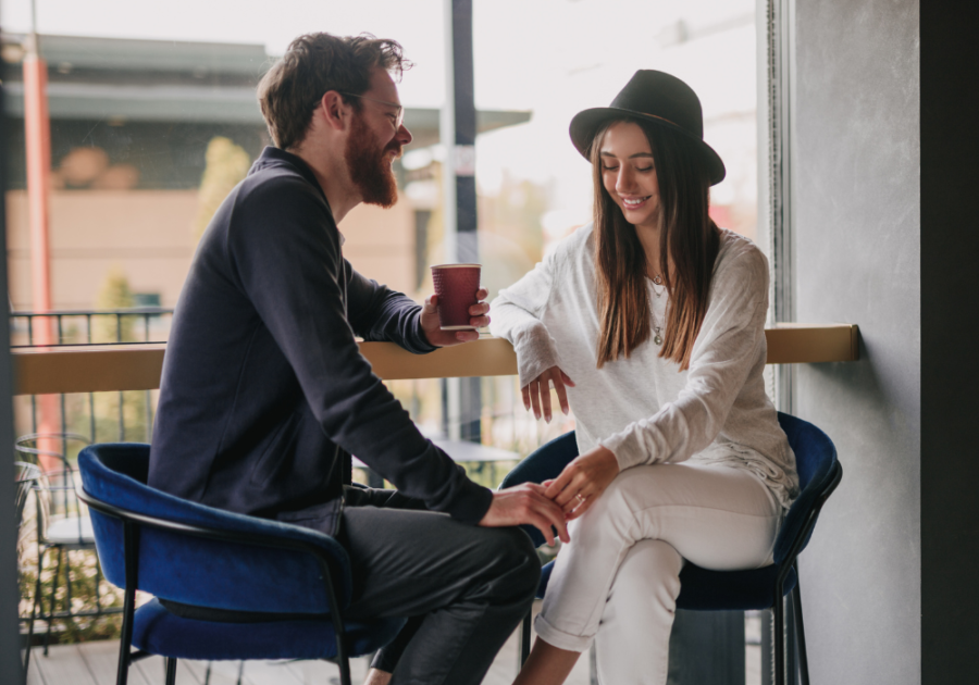 sweet couple having a coffee date Stages of dating