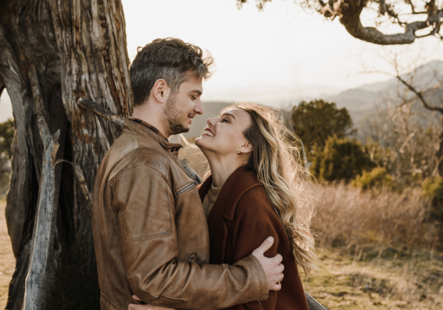 young couple being affectionate in the woods why do women like tall men