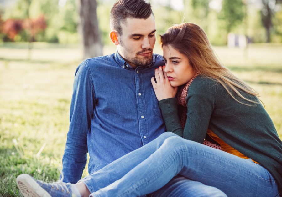 couple on a picnic date hugging signs an avoidant loves you