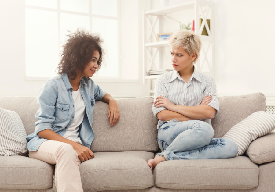 two women talking on sofa Why Are People So Mean?