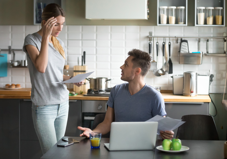 couple looking at papers in the kitchen how to manipulate a narcissist