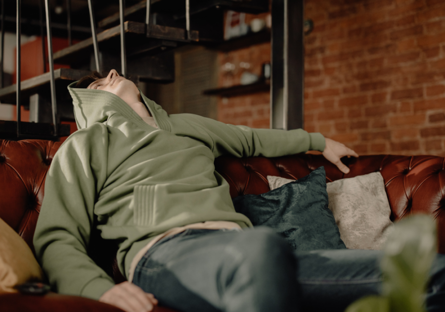 man sitting in couch staring at the ceiling bare minimum in a relationship