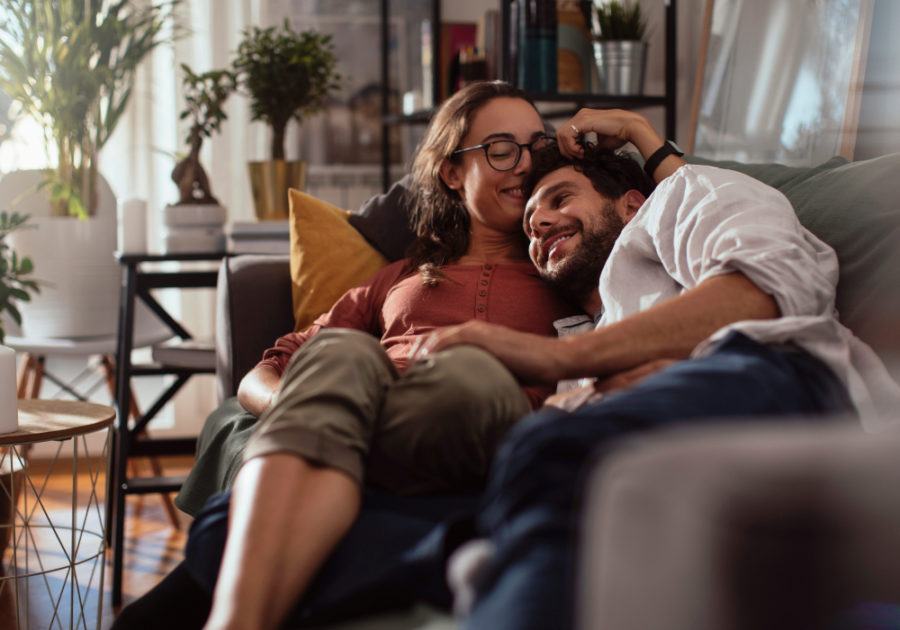 sweet married couple cuddling in the couch psychological facts about soulmates