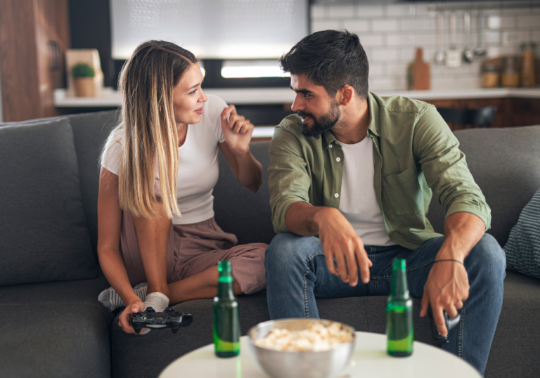 couple having fun with snacks on the table effort in a relationship