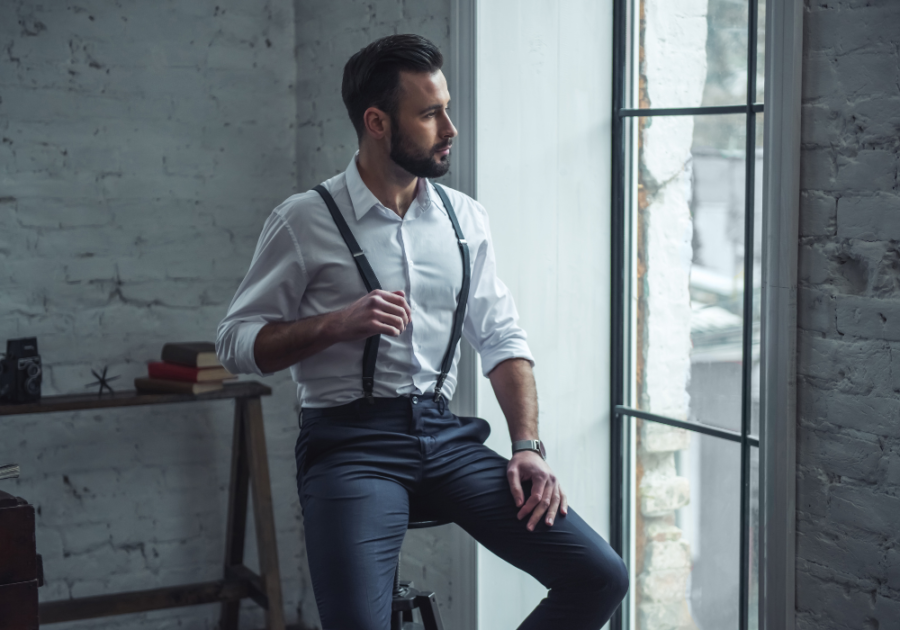 man in suspenders looking outside Sigma Male Tests