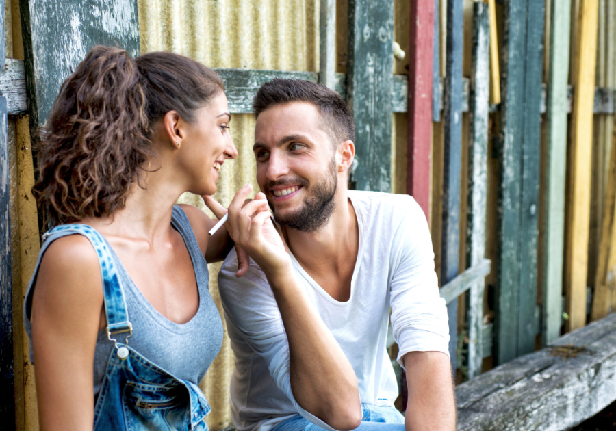 man smiling and touching a woman's face signs he only wants you for your body