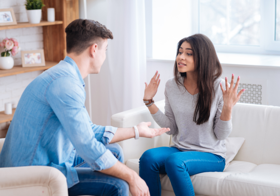 couple talking face to face psychological effects of false allegations in a relationship