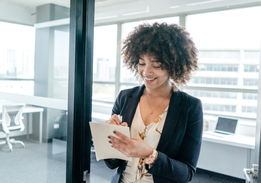 woman standing and writing Best Online Personality Test