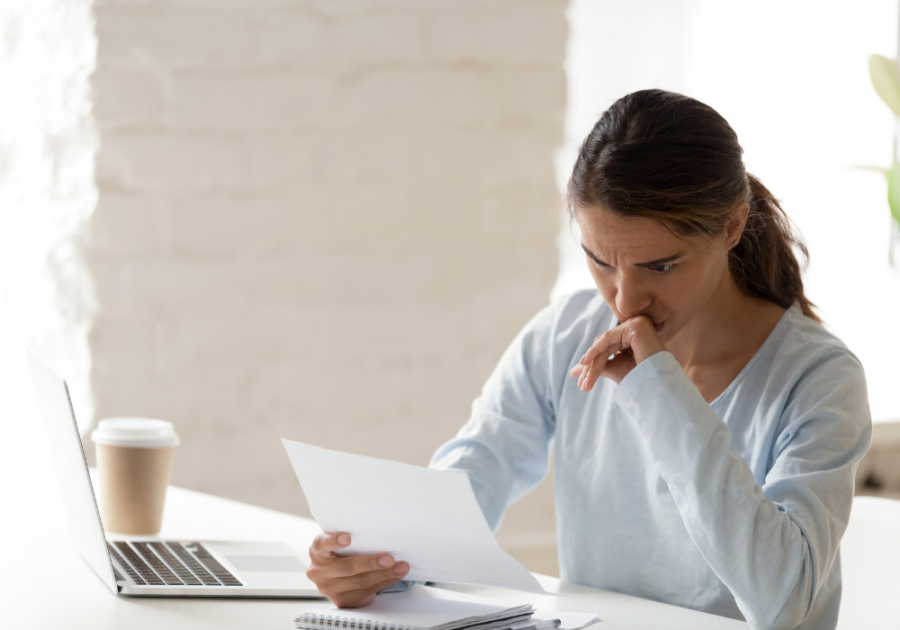 woman reading something while in the coffee shop letters for forgiveness